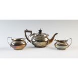 A George V silver bachelors three piece tea service, Charles S Green & Co Ltd, Birmingham 1919, of