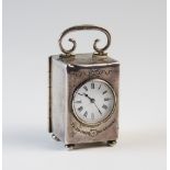 An Edwardian silver cased bedside timepiece London 1906, 'EM' and 'JRH', the plain rectangular