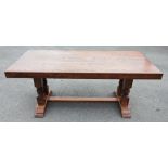 A 17th century style oak refectory table, late 20th century, the rectangular slab top raised upon