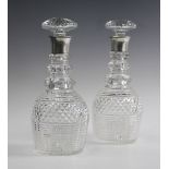 A pair of silver mounted hob nail cut glass decanters and stoppers, John Grinsell and Sons,