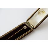 An untested pearl and diamond set stick/tie pin, designed as a central (detachable) untested pearl