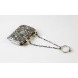 An Edwardian silver lady's purse, Henry Matthews Birmingham 1904, embossed with masks and exotic