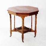An Edwardian walnut octagonal centre table, the moulded top above a galleried under shelf, raised