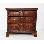 A Charles II and later oak chest of drawers, the rectangular moulded top above three geometrically