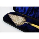 A Victorian silver plated presentation trowel with turned ivory handle, engraved inscription 'To
