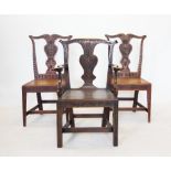 A set of six 18th century style oak dining chairs, 19th century, each chair with a cupids bow top