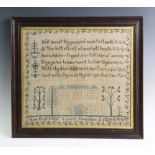 A George IV needlework sampler, worked with a religious verse above a house with flowers and
