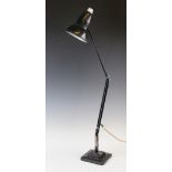 A mid 20th century black angle poise lamp, by Herbert Terry, the bell shaped metal shade with a