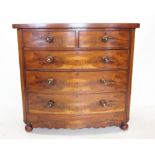 A Victorian mahogany bow front chest of drawers, with two short and three long graduated and cock