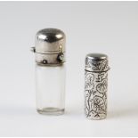 A Victorian silver scent bottle Birmingham 1882, of cylinder form, with engraved continuous