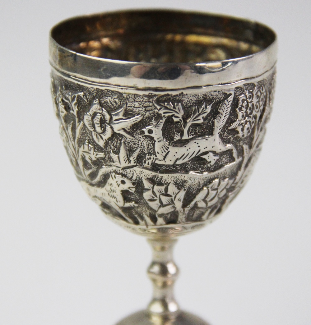 An Anglo-Indian silver double egg or wager cup, each bowl chased with a continuing landscape of - Image 2 of 4