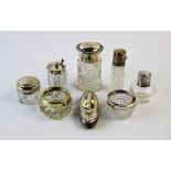 A selection of silver topped dressing table jars, Victorian and later, with further plated examples,