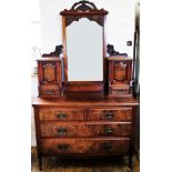 A late Victorian walnut and burr walnut dressing chest, the rectangular mirror with a carved