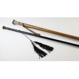 A late 19th century malacca cane with silver mount and brass tip, 97cm long, along with an