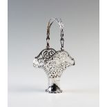 An Edwardian silver basket, Henry Matthews London 1906, of flared form, with pierced detail and