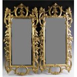 A pair of French Rococo style giltwood wall mirrors, 19th century, each with a 'C' scroll openwork