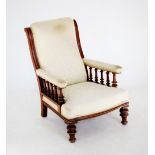 A mid 19th century mahogany and upholstered drawing room chair, the upholstered back above padded