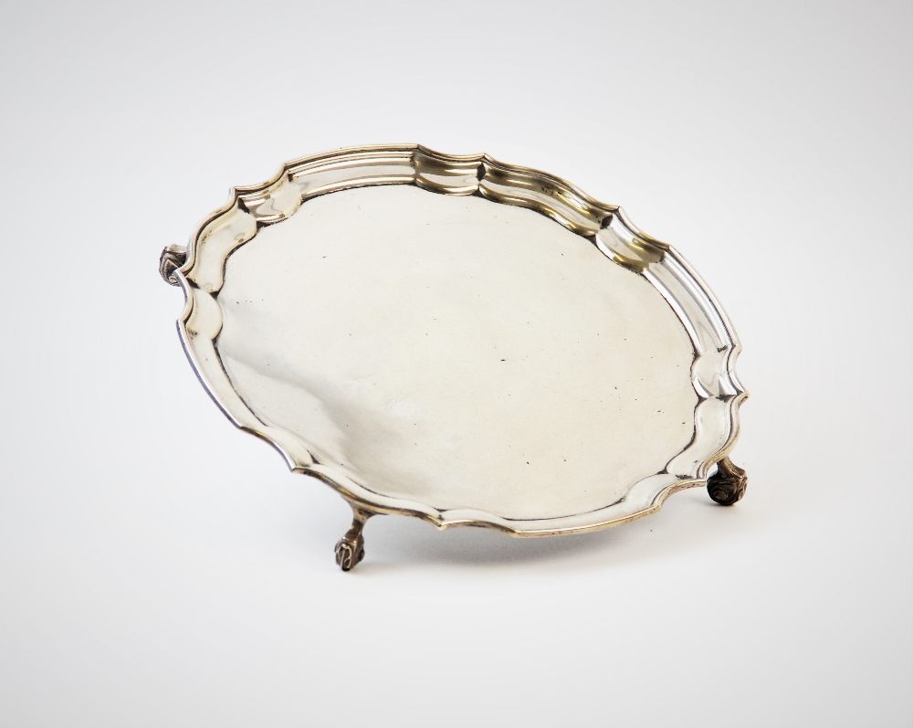 A silver salver, marked for 'T A H', Birmingham 1973, with plain polished bowl, piecrust rim, raised - Image 2 of 3