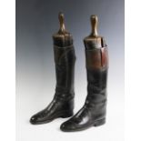 A pair of vintage leather hunting boots, complete with wooden trees, some repairs, 27cm heel to toe