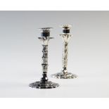 A near pair of palm tree candle or taper sticks, one silver, one plate, both Hawksworth Eyre & Co,