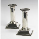 A pair of Victorian silver candlesticks, Mappin & Webb Sheffield 1895 and 1896, each of octagonal