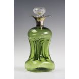 An Edwardian silver mounted green glass glug decanter, William Comyns London 1905, with four spout