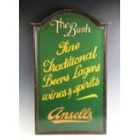 A painted wooden pub sign, of arched form with moulded border, the green ground with coloured