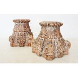 A pair of Rajasthan hardwood column capitals, each of tapering form with carved corner scrolls and
