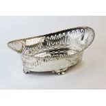 An Edwardian silver basket, Elkington & Co Sheffield 1910, of oval concave form with pierced borders