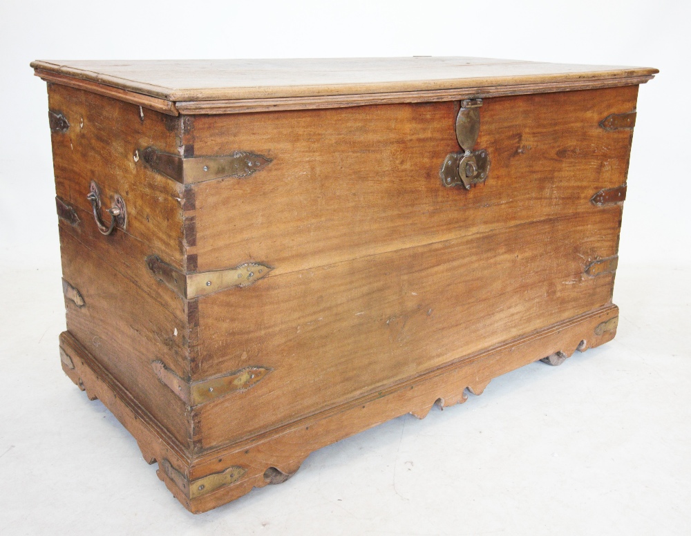 A late 19th century Indian hardwood chest, the rectangular hinged top with shaped brass clasp lock