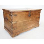 A late 19th century Indian hardwood chest, the rectangular hinged top with shaped brass clasp lock