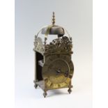 A Charles II brass lantern clock by Thomas Bagley, London, 1665 to 1666, the brass bell strap with a