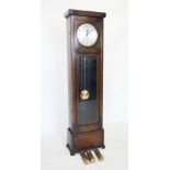 An early 20th century oak cased longcase clock, the flat top with a reeded frieze above the 28cm