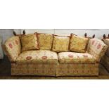 A Knole settee, late 20th century, the drop ends with rope ties, enclosing two seat cushions and a