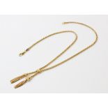 A 9ct gold tassel drop necklace, comprising a rope link chain, approx. 42cm long, terminating in two