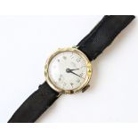A Lady's vintage 9ct gold wristwatch, the circular cream dial with Arabic numerals and subsidiary