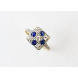 An early 20th century diamond and sapphire square cluster ring, comprising five old cut diamonds