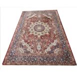 A modern silk Persian pattern carpet, the traditional design in shades of red, white and blue, 345cm