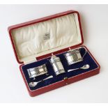 A George V three-piece silver condiment set, Adie Brothers, Birmingham 1928, comprising a wet
