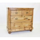 A Victorian pine chest of drawers, the rectangular top with rounded front corners, above two short