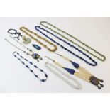 A selection of lady's costume jewellery, to include a carved jade pendant, an agate set pendant,