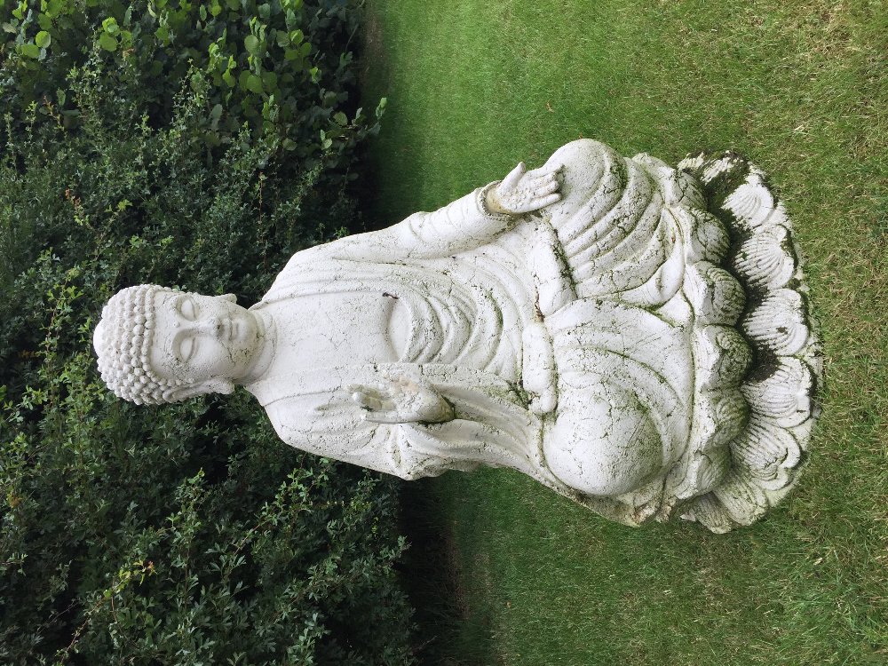 A large decorative composition model of Buddha, white painted, 93cm high with a similar smaller