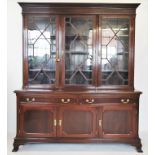 An Edwardian mahogany library bookcase, the moulded cornice with a Greek key pattern frieze above