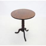 A 19th century mahogany tripod lamp table, the circular top raised upon a ring turned column and