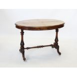 A Victorian burr walnut oval occasional table, the quarter veneered moulded oval top raised upon