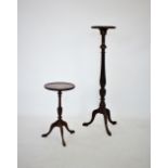 A 19th century style mahogany torchere, 20th century, the circular tray top raised upon a fluted and