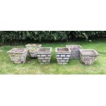 A selection of six reconstituted stone garden planters, each of tapered square form and with brick