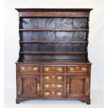 A late 18th century oak North Walian dresser, the high back with an ovolo cornice above a plain