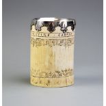 A white metal mounted scrimshaw tusk pot, inscribed 'Frine favfer und fief' below the metal