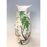 A 19th century Chinese porcelain vase, of baluster from and decorated in the famille verte colour